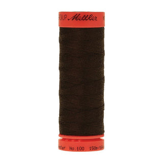 Mettler Metrosene 100% Polyester Cotton #1048 Dark Amber from Gabriele's Sewing & Crafts is a durable fine sewing thread that sews delicate silks to tough denim.