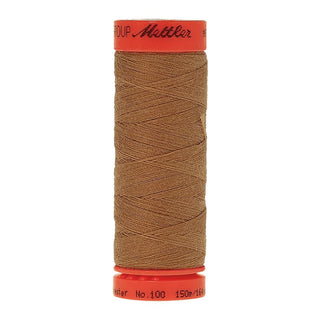 Mettler Metrosene 100% Polyester Cotton #1121 Toffee from Gabriele's Sewing & Crafts is a durable fine sewing thread that sews delicate silks to tough denim.