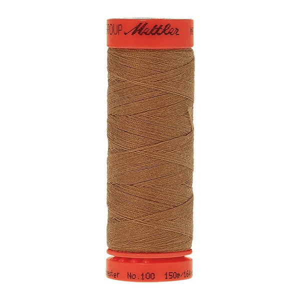 Mettler Metrosene 100% Polyester Cotton #1121 Toffee from Gabriele's Sewing & Crafts is a durable fine sewing thread that sews delicate silks to tough denim.