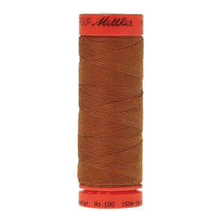 Mettler Metrosene 100% Polyester Cotton #1131 Brass from Gabriele's Sewing & Crafts is a durable fine sewing thread that sews delicate silks to tough denim.