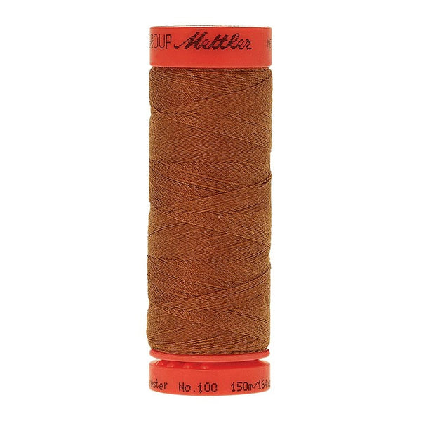 Mettler Metrosene 100% Polyester Cotton #1131 Brass from Gabriele's Sewing & Crafts is a durable fine sewing thread that sews delicate silks to tough denim.