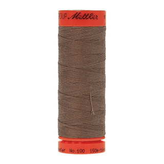 Mettler Metrosene 100% Polyester Cotton #1228 Khaki from Gabriele's Sewing & Crafts is a durable fine sewing thread that sews delicate silks to tough denim.