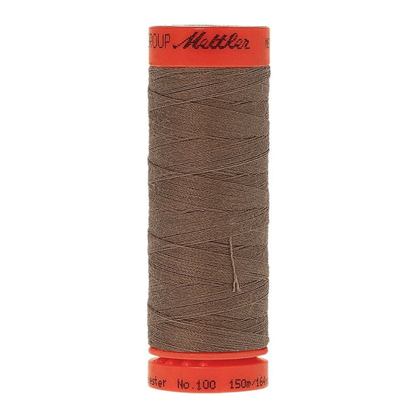 Mettler Metrosene 100% Polyester Cotton #1228 Khaki from Gabriele's Sewing & Crafts is a durable fine sewing thread that sews delicate silks to tough denim.