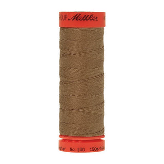 Mettler Metrosene 100% Polyester Cotton #0475 Wild Rice from Gabriele's Sewing & Crafts is a durable fine sewing thread that sews delicate silks to tough denim.