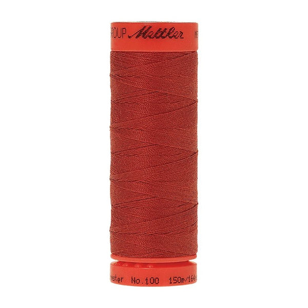 Mettler Metrosene 100% Polyester Cotton #0508 Dark Rust from Gabriele's Sewing & Crafts is a durable fine sewing thread that sews delicate silks to tough denim.
