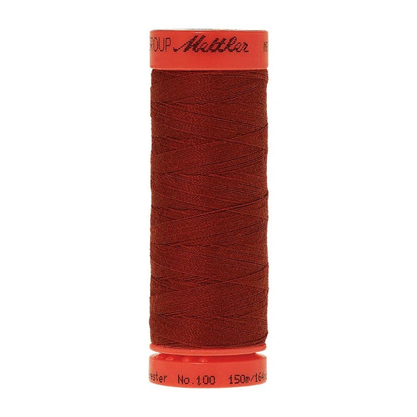 Mettler Metrosene 100% Polyester Cotton #0636 Spice from Gabriele's Sewing & Crafts is a durable fine sewing thread that sews delicate silks to tough denim.